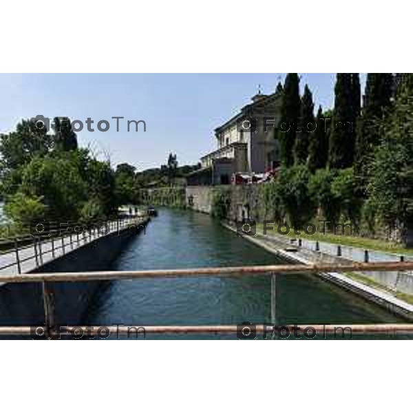 Tiziano Manzoni/LaPresse 6--07- 2024 Bergamo, Italia Cronaca Trezzo d\'Adda santuario Concesa le ricerche di Claudio Togni, inghiottito dal fiume venerdì scorso mentre lavorava alla centrale elettrica Italgen di Vaprio l\'acqua è stata fatta uscire dagli sbarramenti e per ridurne la quantità è stata deviata nei canali; come il naviglio Martesana, che nasce a monte di Concesa, il punto in cui è avvenuto il drammatico incidente